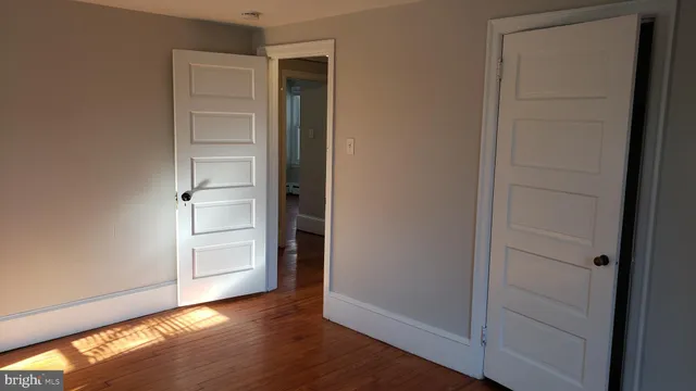 wooden floor and closet in a room
