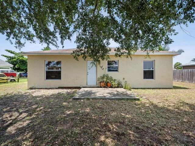 a house with trees in front of it