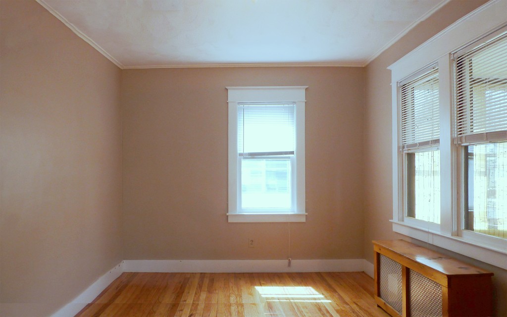 95-97 Dwight Road Springfield, MA 01108 - Photo 7 of 19 a view of empty room with wooden floor and fan