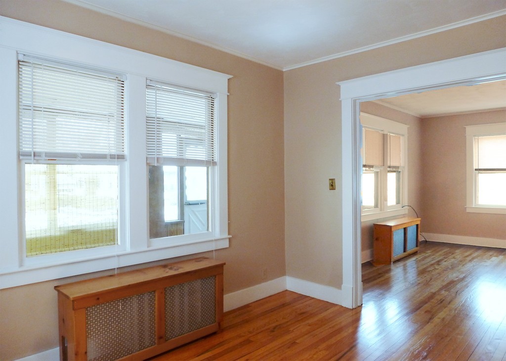 95-97 Dwight Road Springfield, MA 01108 - Photo 8 of 19 an empty room with wooden floor and windows