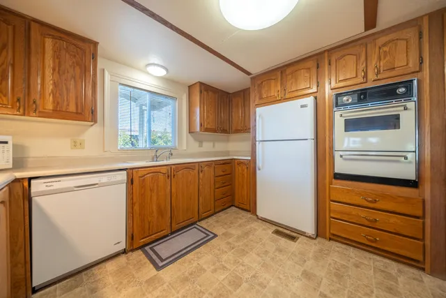 a kitchen with sink cabinets and window