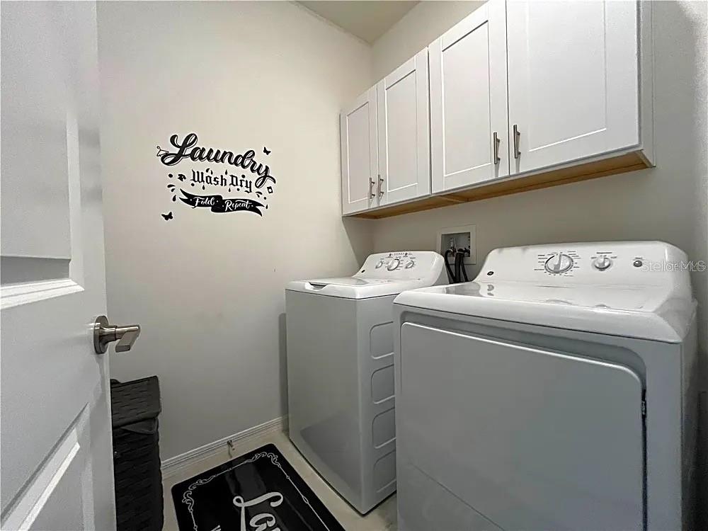 31751 Blue Passing Loop Wesley Chapel, FL 33545 - Photo 8 of 18 a utility room with dryer and washer