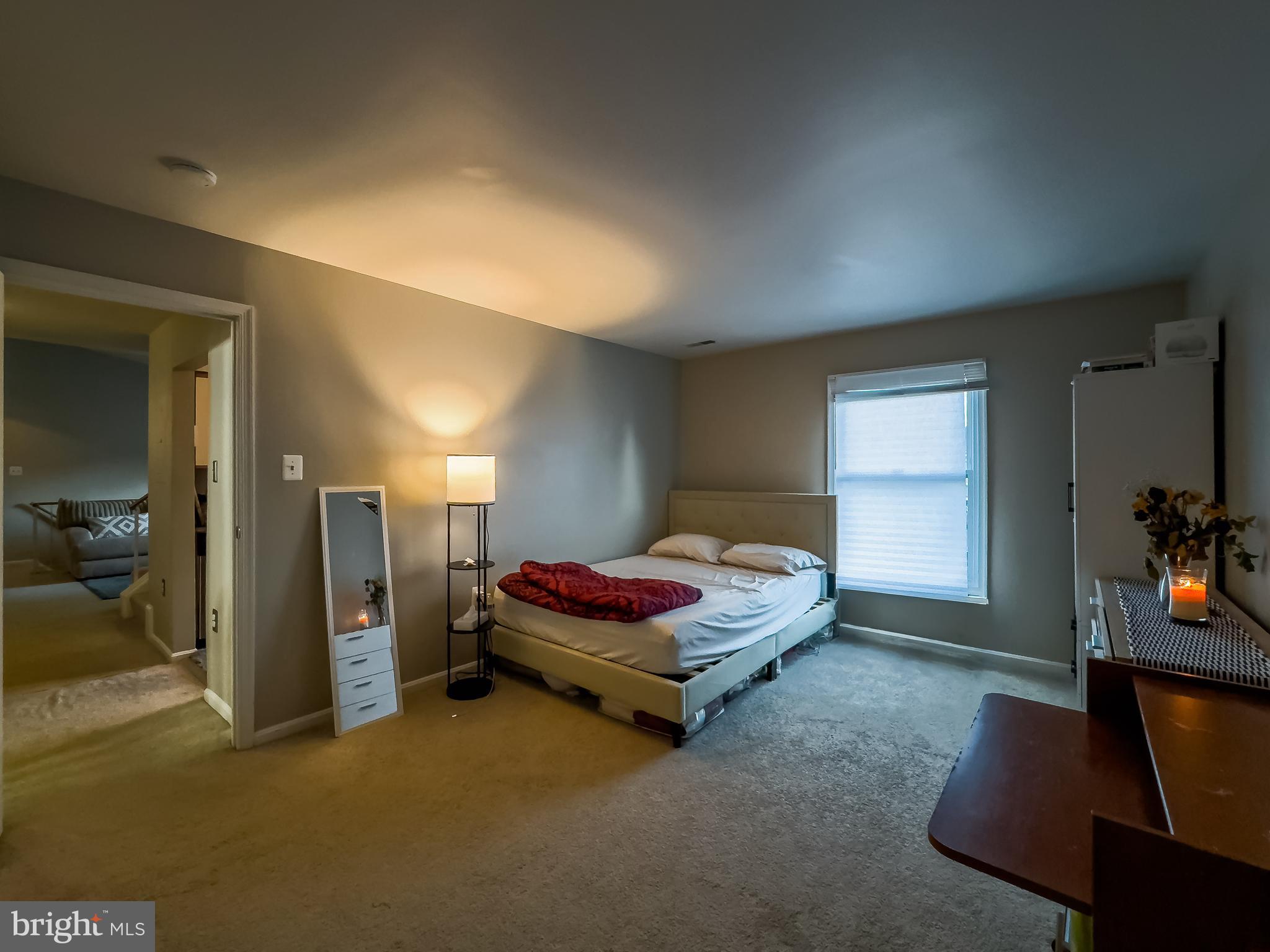 7416 Rokeby Drive Manassas, VA 20109 - Photo 10 of 17 a spacious bedroom with a bed and a couch