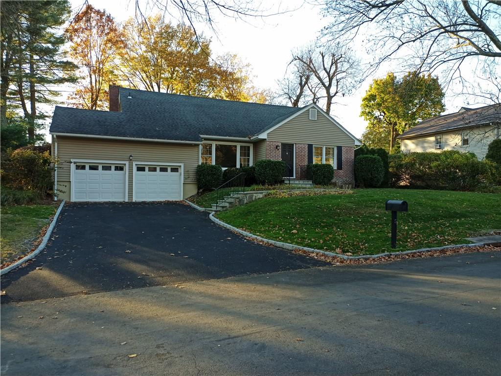 5 Copper Beech Circle White Plains, NY 10605 - Photo 1 of 1 View of front of house featuring a garage and a front lawn