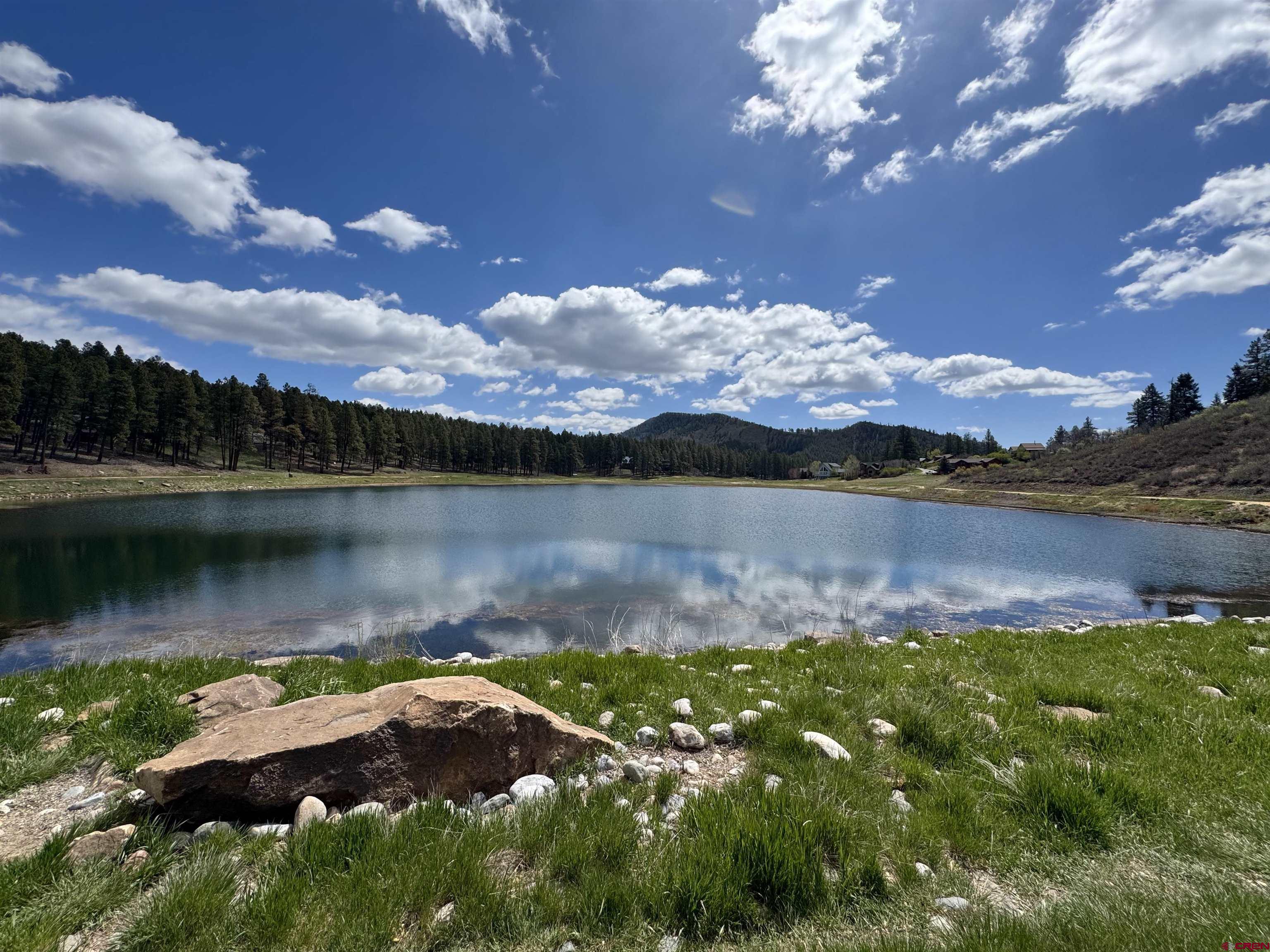 1142 Deer Ridge Drive Bayfield, CO 81122 - Photo 14 of 15 a view of a lake with houses in the back