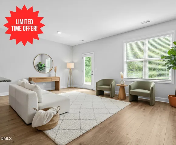 a bedroom with furniture and a large window