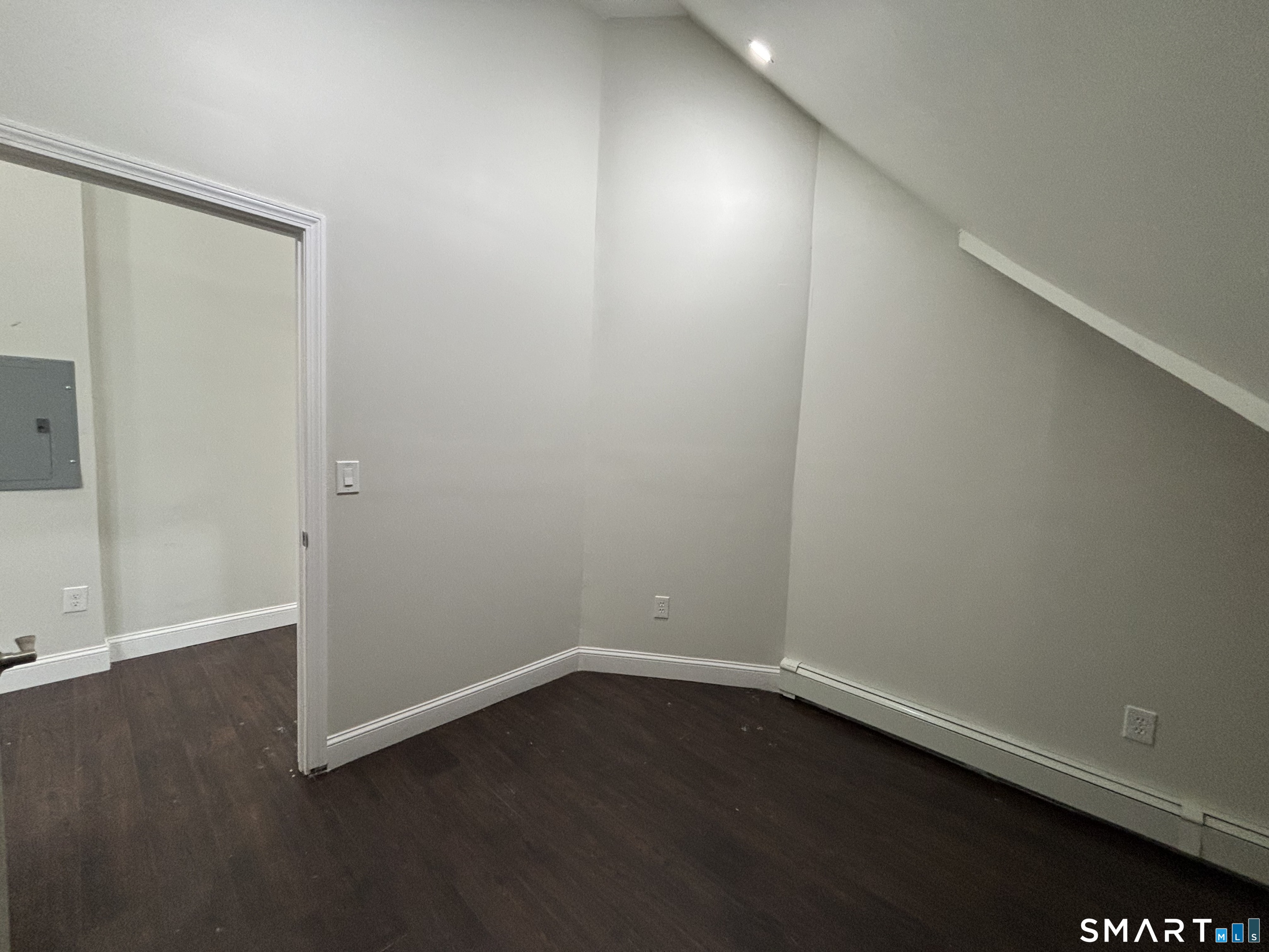 241 Lewis Street Bridgeport, CT 06605 - Photo 27 of 33 an empty room with wooden floor and windows