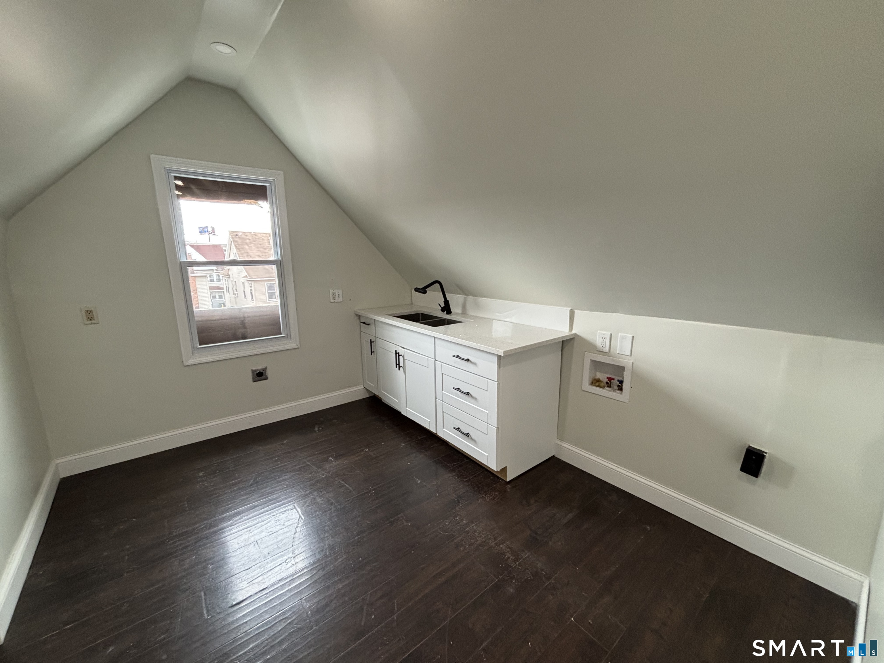 241 Lewis Street Bridgeport, CT 06605 - Photo 32 of 33 a storage room with wooden floor and windows