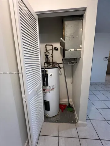 a room with washing machine and a sink