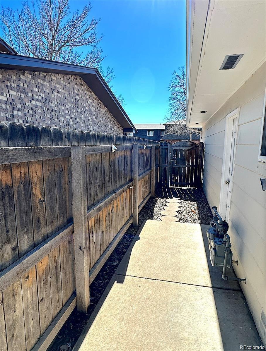1405 East 16th Street, Unit B Loveland, CO 80538 - Photo 12 of 14 a view of balcony with wooden fence