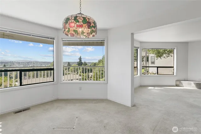 an empty room with windows and view