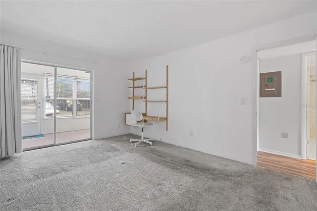 a view of an empty room with a window