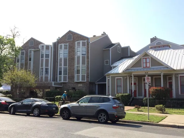 a view of a car parked in front of a houses