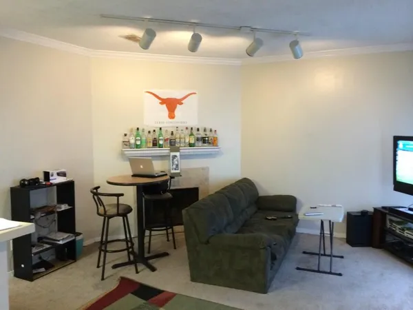 a living room with furniture and a window
