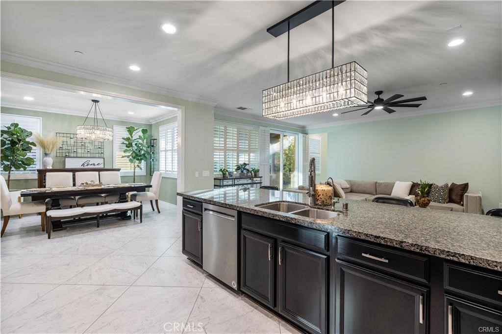 28537 Vista Del Rio Drive Valencia, CA 91354 - Photo 9 of 31 a kitchen with a sink and chandelier