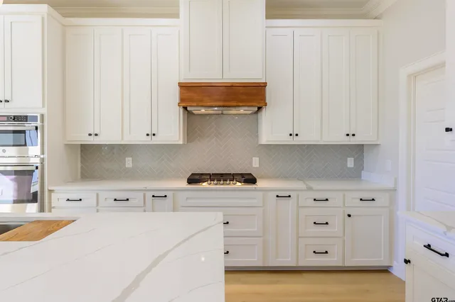 a bedroom with furniture and kitchen view
