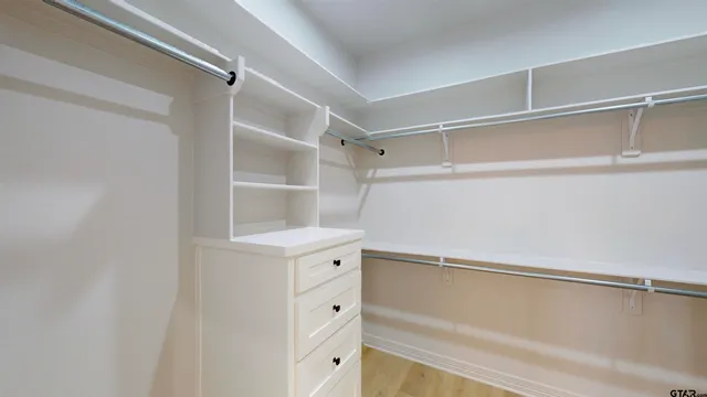 a view of room with window and ceiling fan