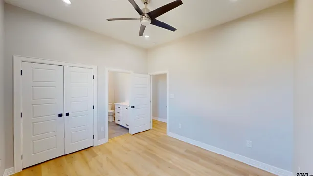 a bathroom with a toilet a sink and a shower