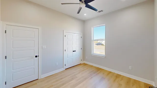 a view of kitchen and kitchen with furniture wooden floor