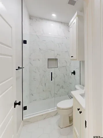 a view of kitchen and kitchen with stainless steel appliances