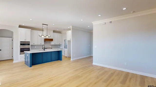 a kitchen with cabinets and appliances