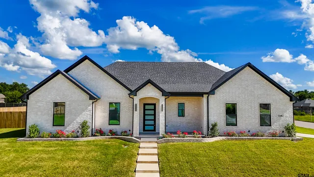 a view of a house with a big yard