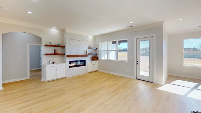 a view of a kitchen with furniture and a fireplace