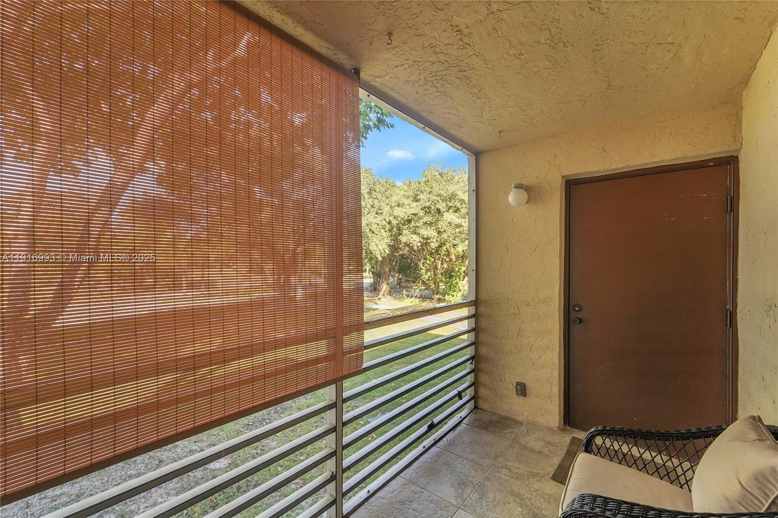 8405 Northwest 61st Street, Unit D207 Tamarac, FL 33321 - Photo 12 of 28 a view of an empty room and window