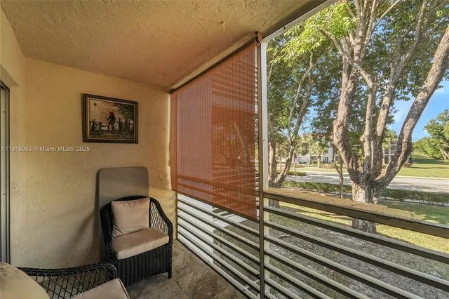 a view of a entryway door with wooden floor