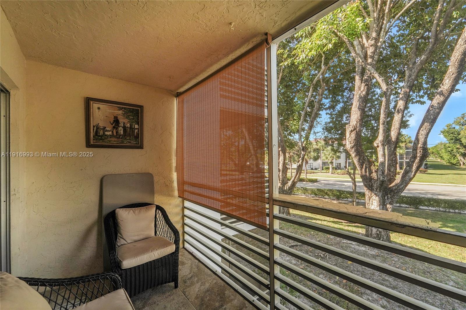 8405 Northwest 61st Street, Unit D207 Tamarac, FL 33321 - Photo 13 of 28 a view of a entryway door with wooden floor