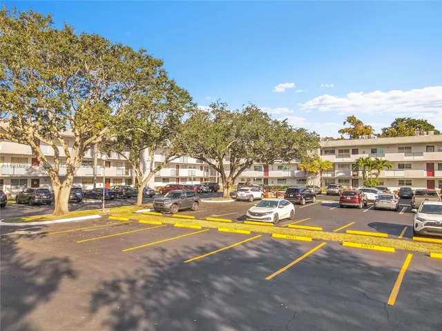 a view of a swimming pool with outdoor seating