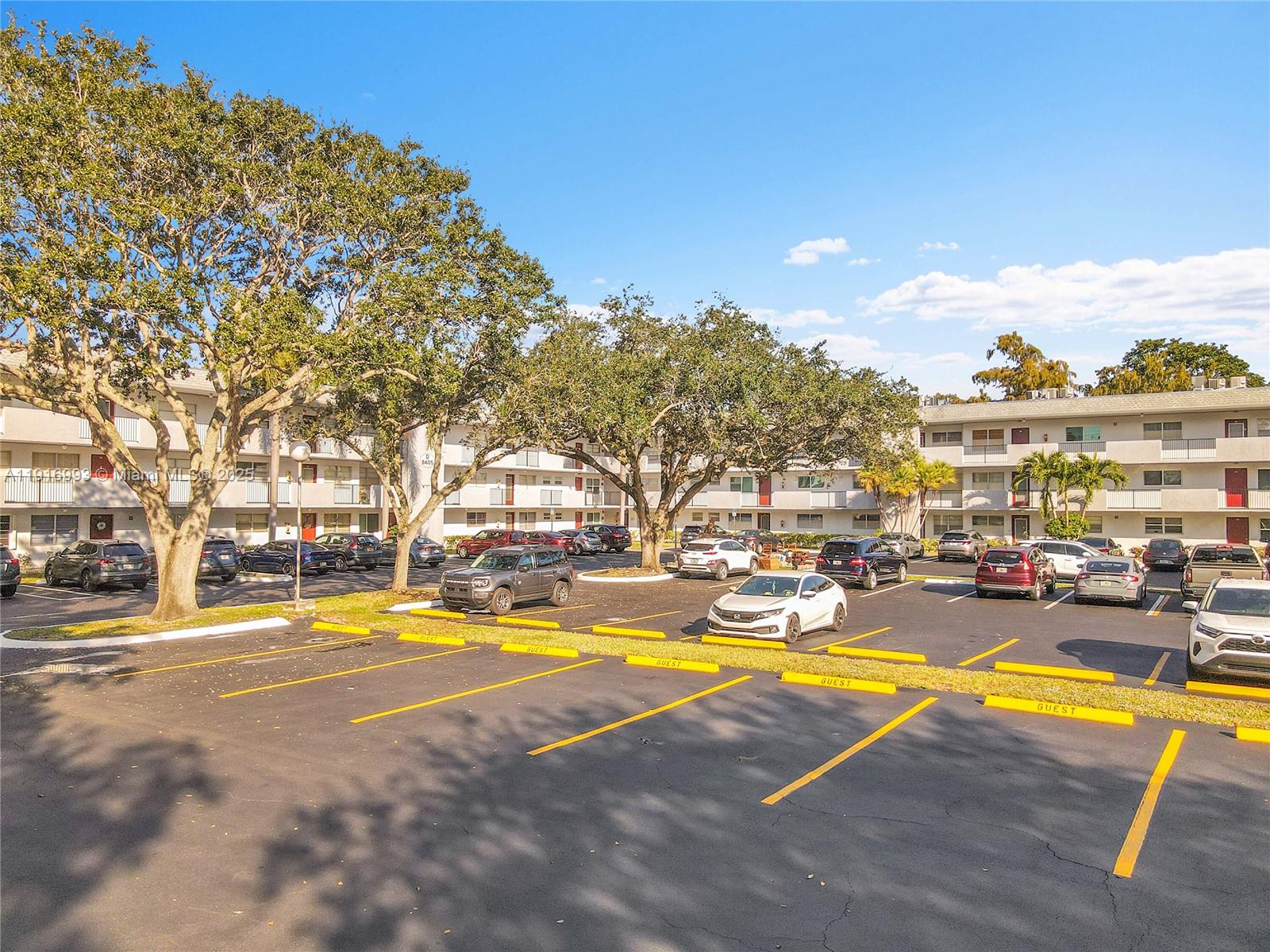 8405 Northwest 61st Street, Unit D207 Tamarac, FL 33321 - Photo 19 of 28 a view of a swimming pool with outdoor seating