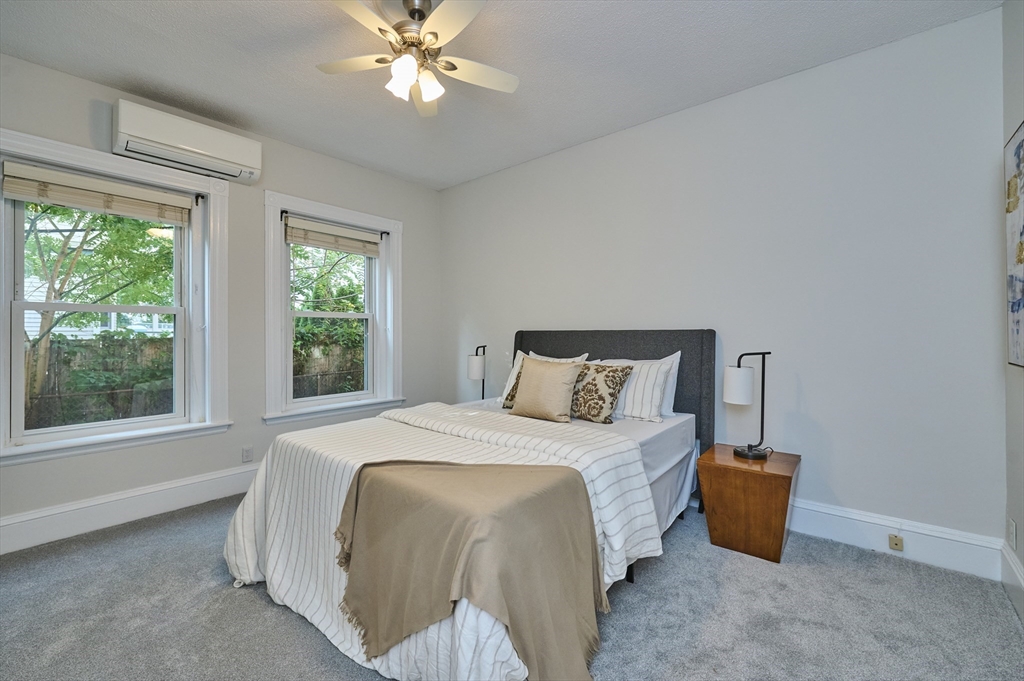5 Auburn Court, Unit 1 Brookline, MA 02446 - Photo 13 of 22 a bedroom with a bed and a window