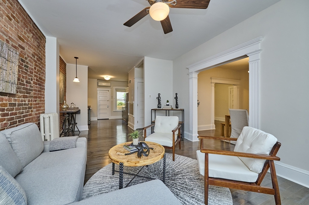 5 Auburn Court, Unit 1 Brookline, MA 02446 - Photo 4 of 22 a living room with furniture and a large window