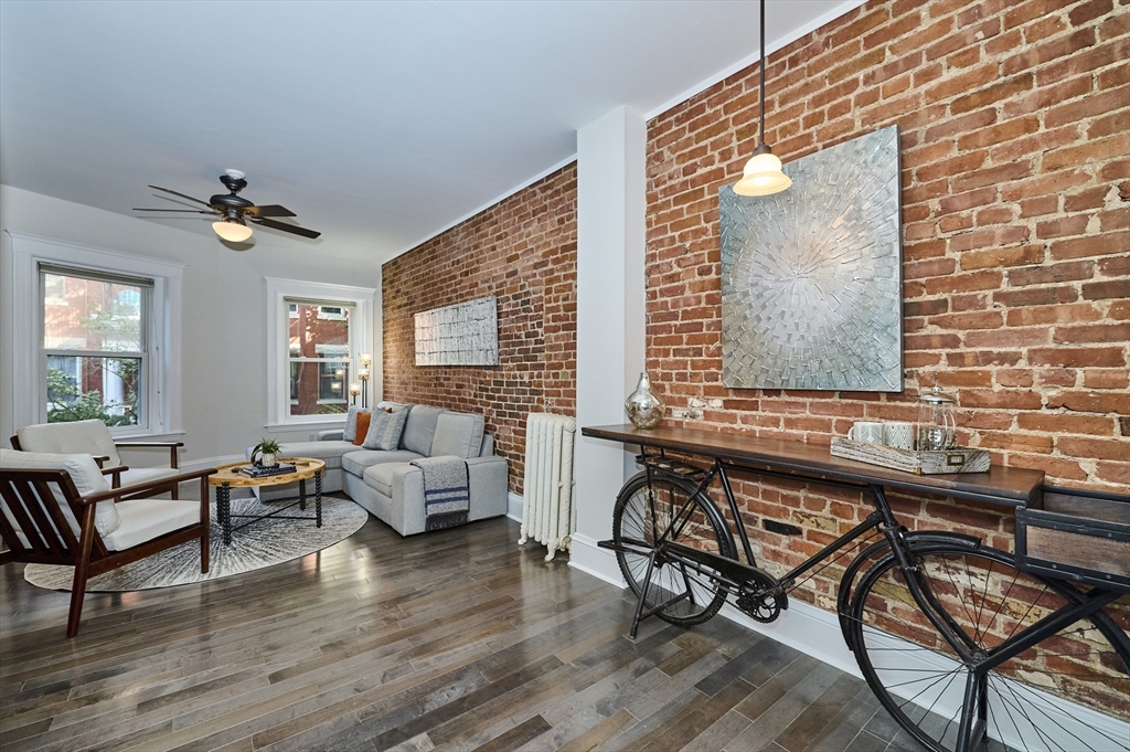 5 Auburn Court, Unit 1 Brookline, MA 02446 - Photo 5 of 22 a living room with furniture and wooden floor