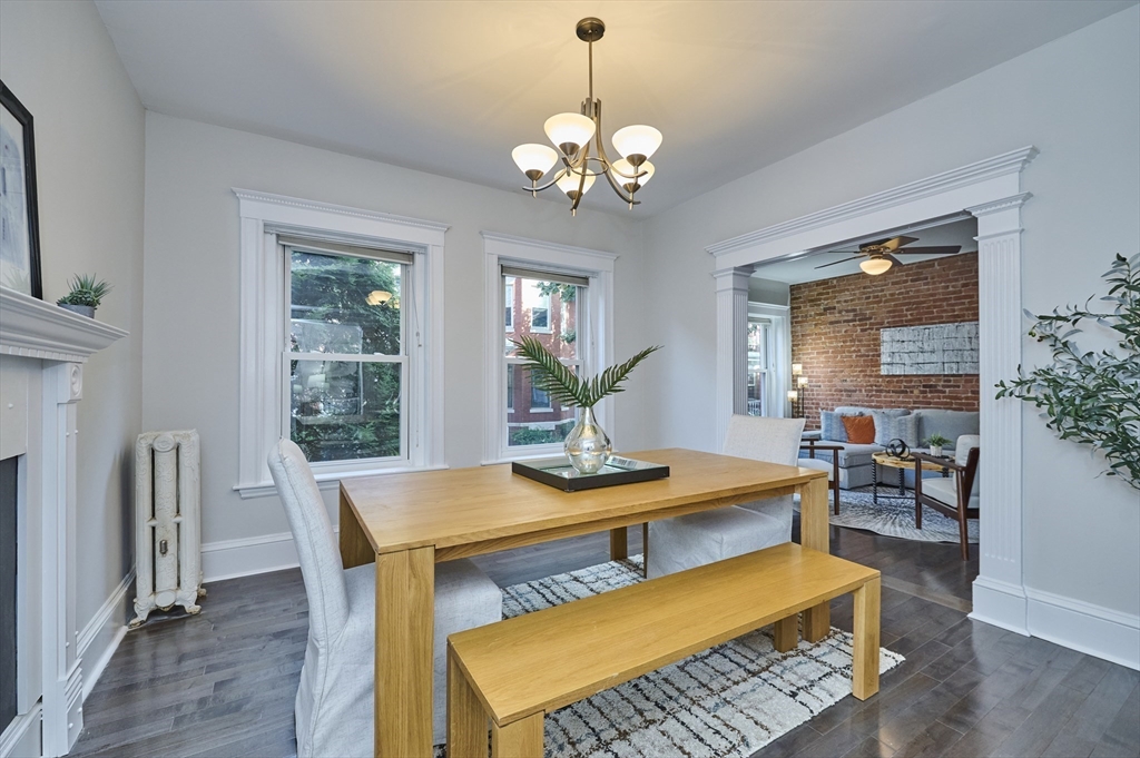 5 Auburn Court, Unit 1 Brookline, MA 02446 - Photo 10 of 22 a view of a dining room with furniture and a chandelier