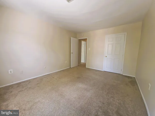 a view of an empty room and entryway