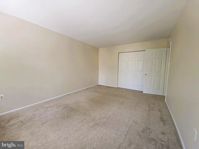a view of an empty room and entryway