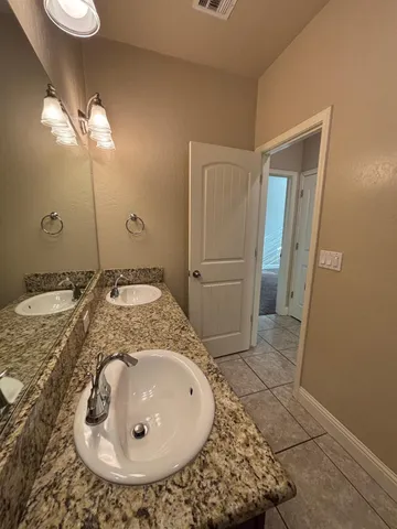 en empty room with windows and ceiling fan