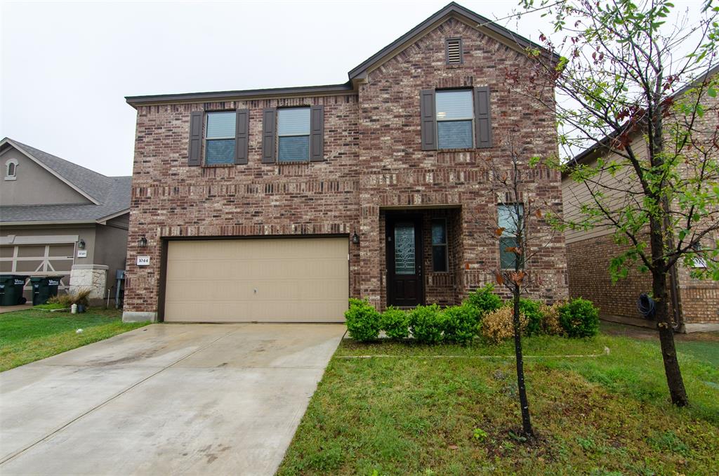 1044 Clove Hitch Road Georgetown, TX 78633 - Photo 1 of 19 a front view of a house with garden
