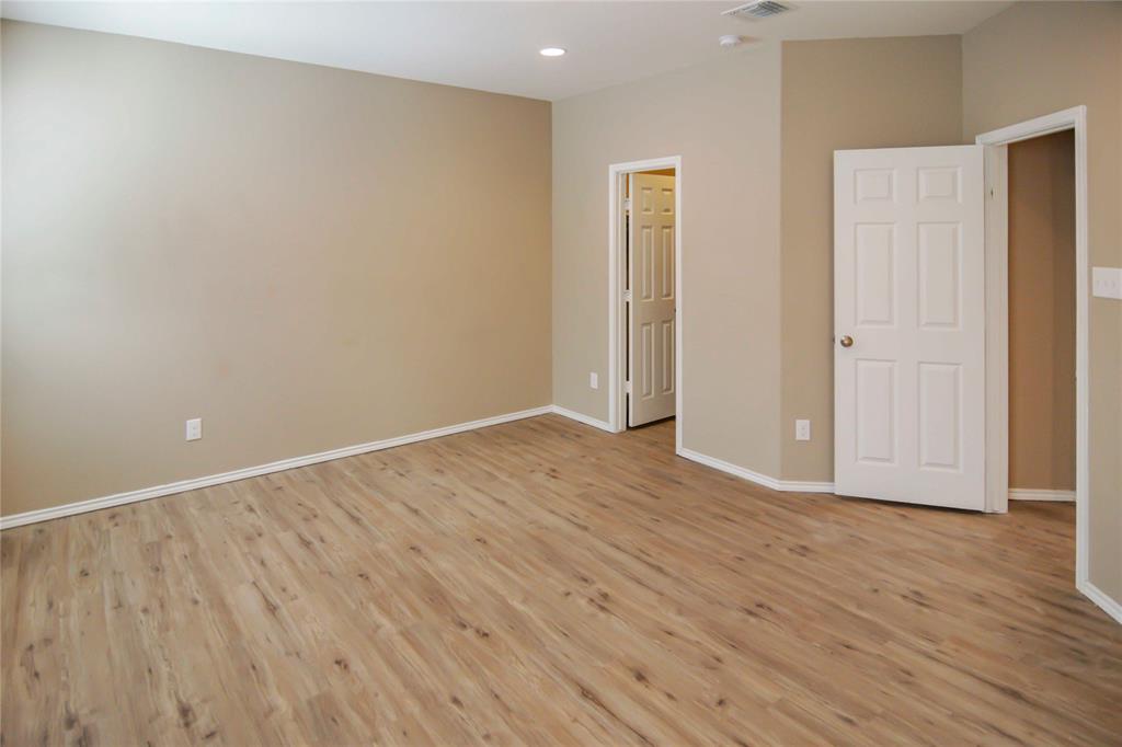 1044 Clove Hitch Road Georgetown, TX 78633 - Photo 17 of 19 a view of an empty room with wooden floor