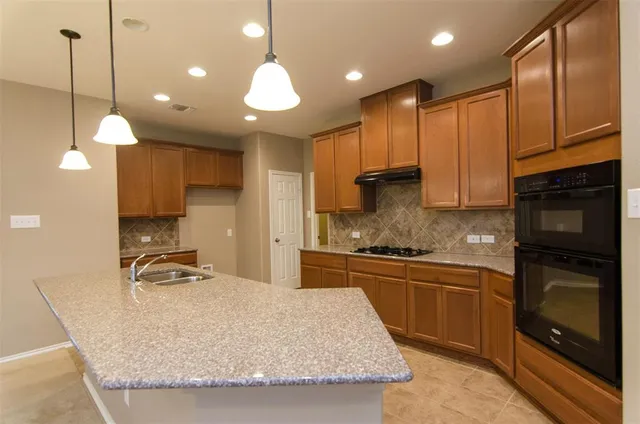 a large kitchen with stainless steel appliances kitchen island a large island in the center