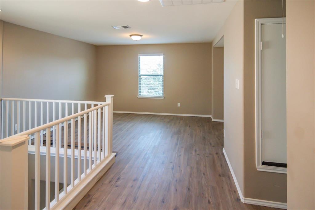 1044 Clove Hitch Road Georgetown, TX 78633 - Photo 8 of 19 a view of hallway with wooden floor