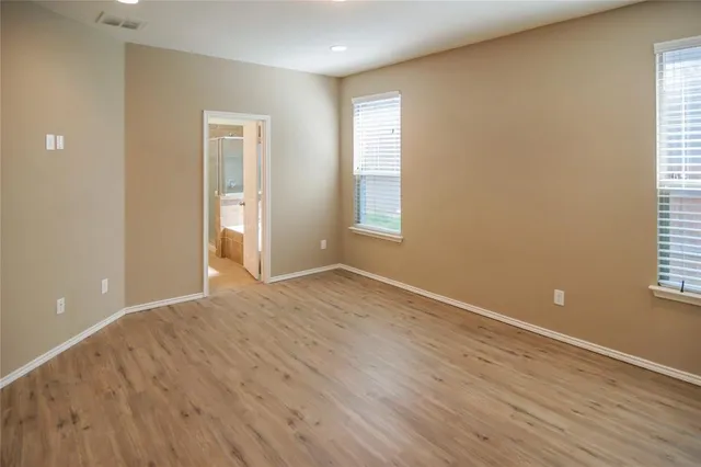 a view of hallway with wooden floor