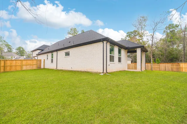 a view of backyard with green space