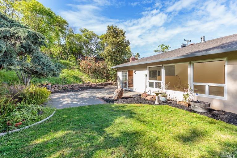 443 Montecillo Road San Rafael, CA 94903 - Photo 1 of 1 Backyard with patio and grass area.
