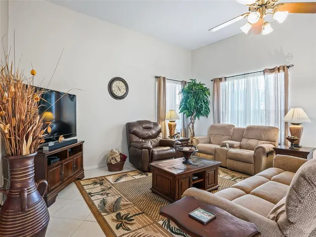 a kitchen with a sink and chairs