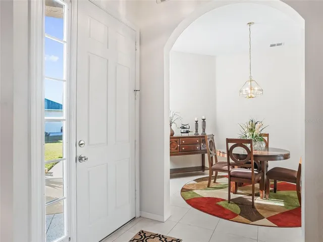 a bedroom with two bed and painting on the wall
