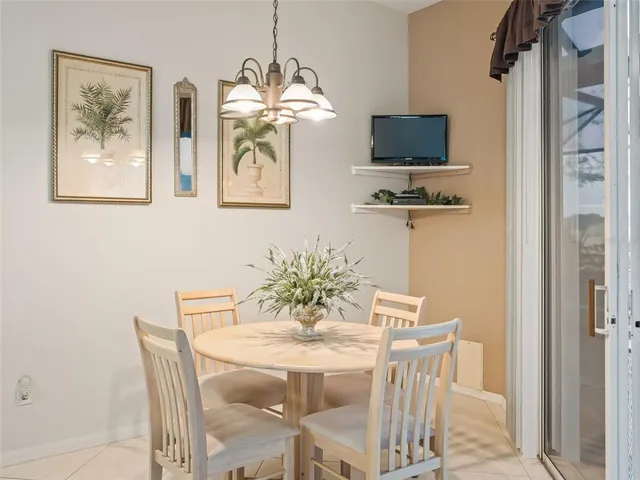 a view of a swimming pool with a yard and sitting area