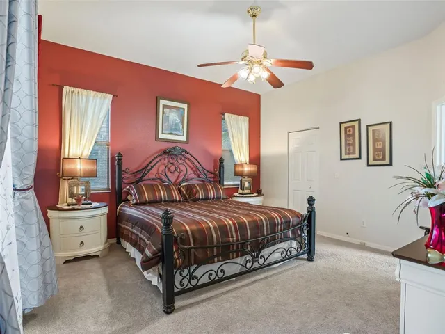 an aerial view of a house with garden space and outdoor seating